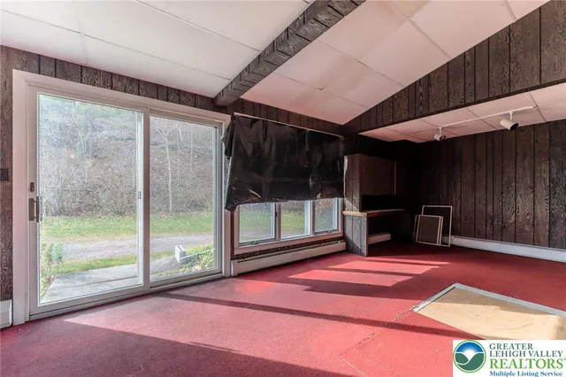 a bathroom with a shower and a glass door