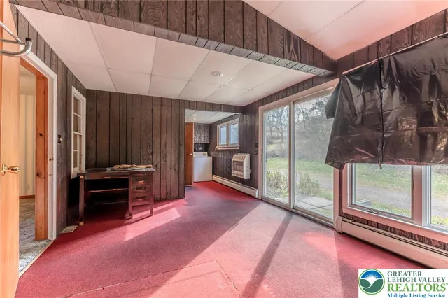 a view of an empty room and window