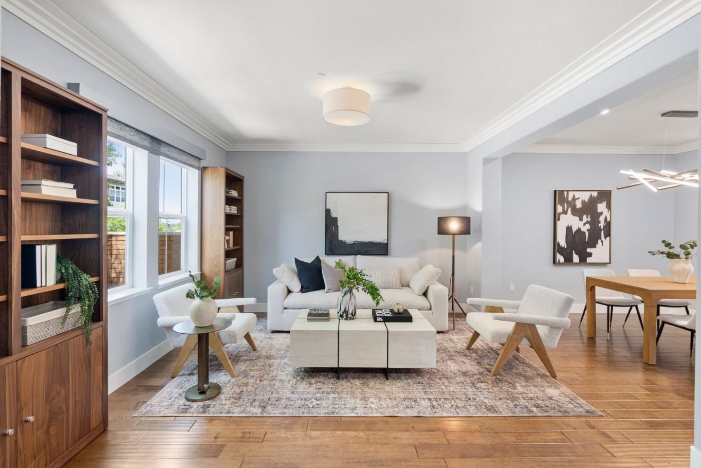 a living room with furniture and a book shelf