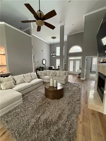 a living room with furniture and flat screen tv