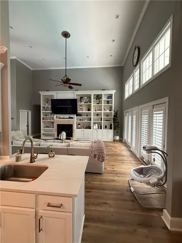 a spacious bedroom with a bed and a chandelier