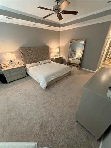 a bathroom with a white tub sitting next to a window