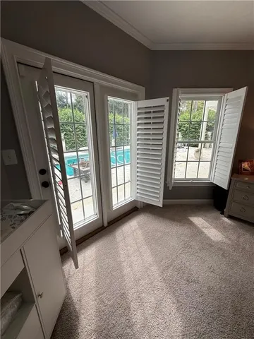 a bathroom with a granite countertop sink toilet a mirror and shower