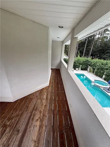 a view of a swimming pool with a lake view and mountain view
