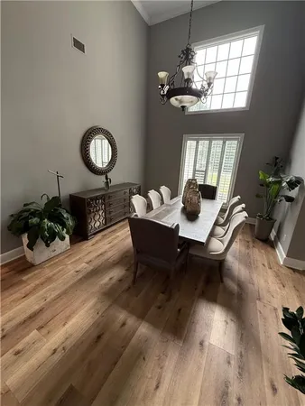 a view of an empty room with a fireplace and a window