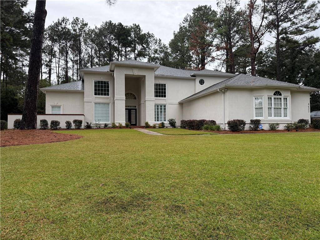 4632 Ridgeview Circle Valdosta, GA 31602 - Photo 6 of 70 a front view of house with yard and trees in the background