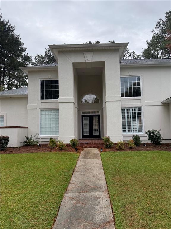 4632 Ridgeview Circle Valdosta, GA 31602 - Photo 8 of 70 a front view of a house with a yard