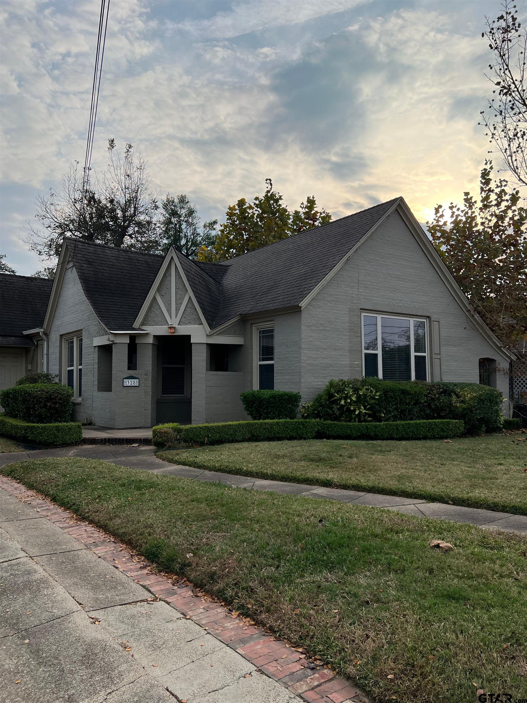 328 Mockingbird Lane Tyler, TX 75701 - Photo 1 of 12 a front view of a house with a yard
