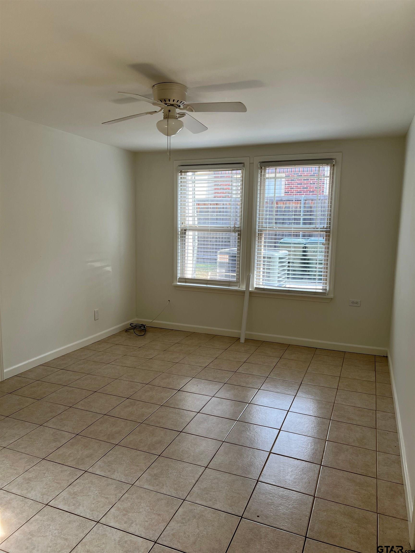 328 Mockingbird Lane Tyler, TX 75701 - Photo 10 of 12 a view of an empty room with a window