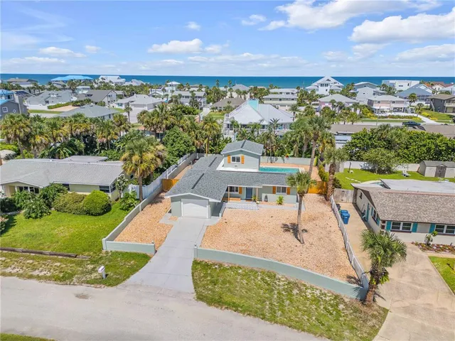 an aerial view of a house with a garden