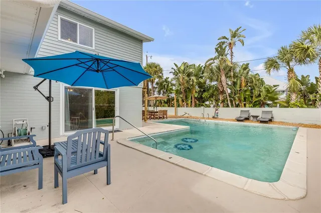 a view of a backyard with a patio