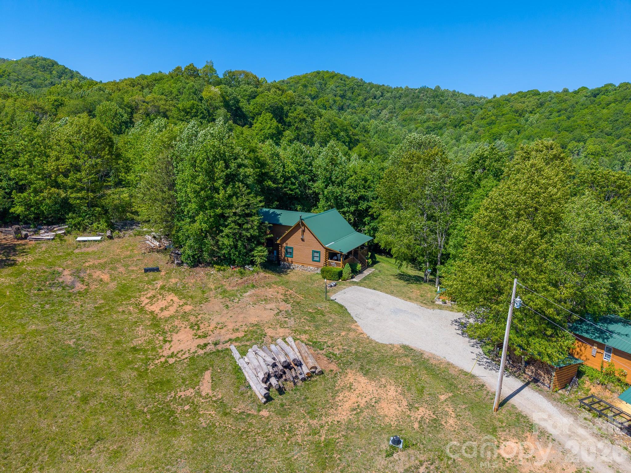 451 Rustic Ridge Drive Canton, NC 28716 - Photo 41 of 44 a view of a house with a yard