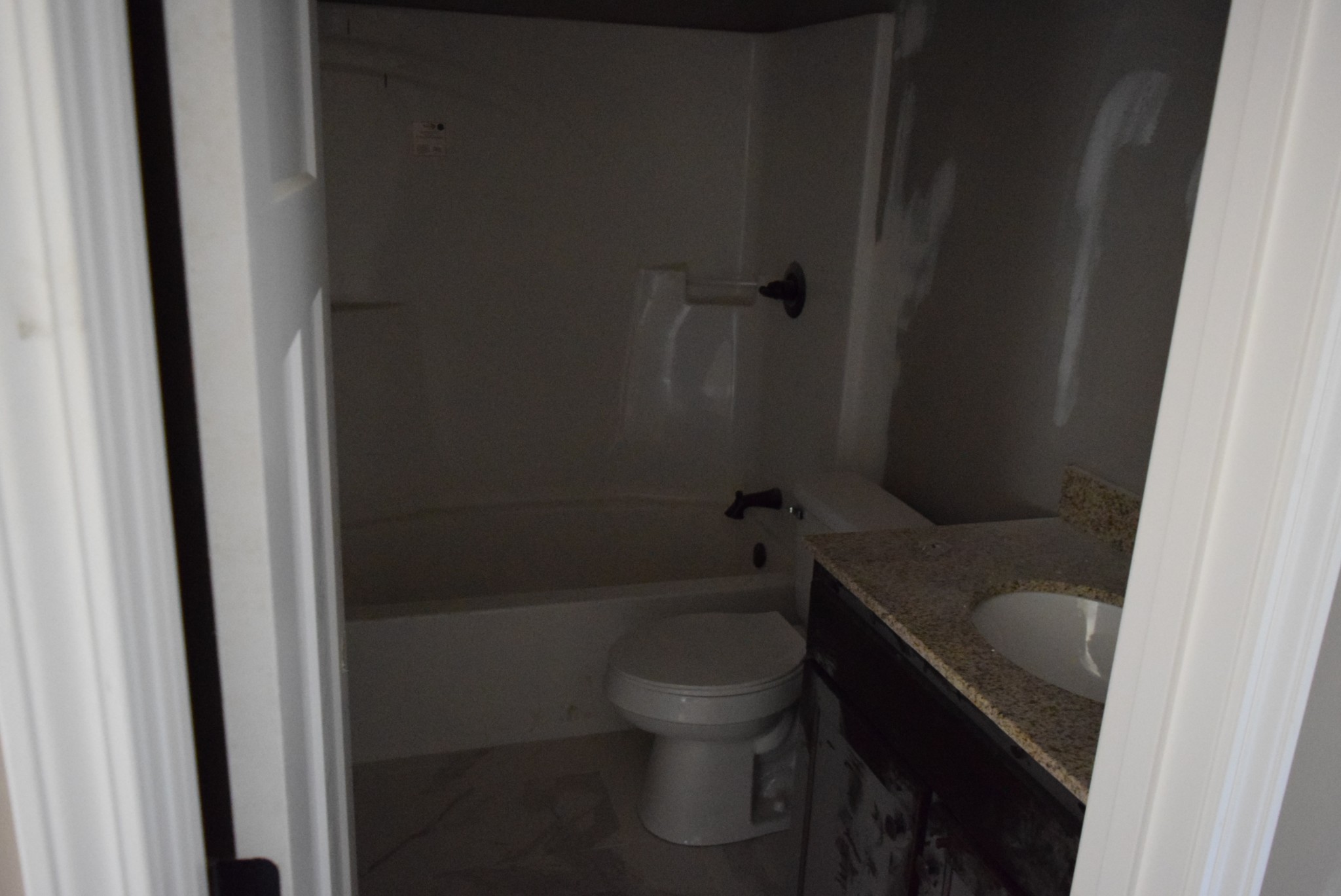 487 Ballard Road Manchester, TN 37355 - Photo 5 of 8 a bathroom with a granite countertop toilet and a sink