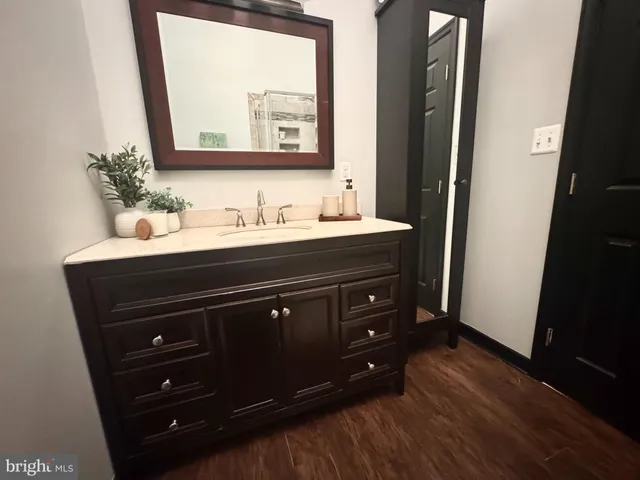 a bathroom with a sink and a mirror