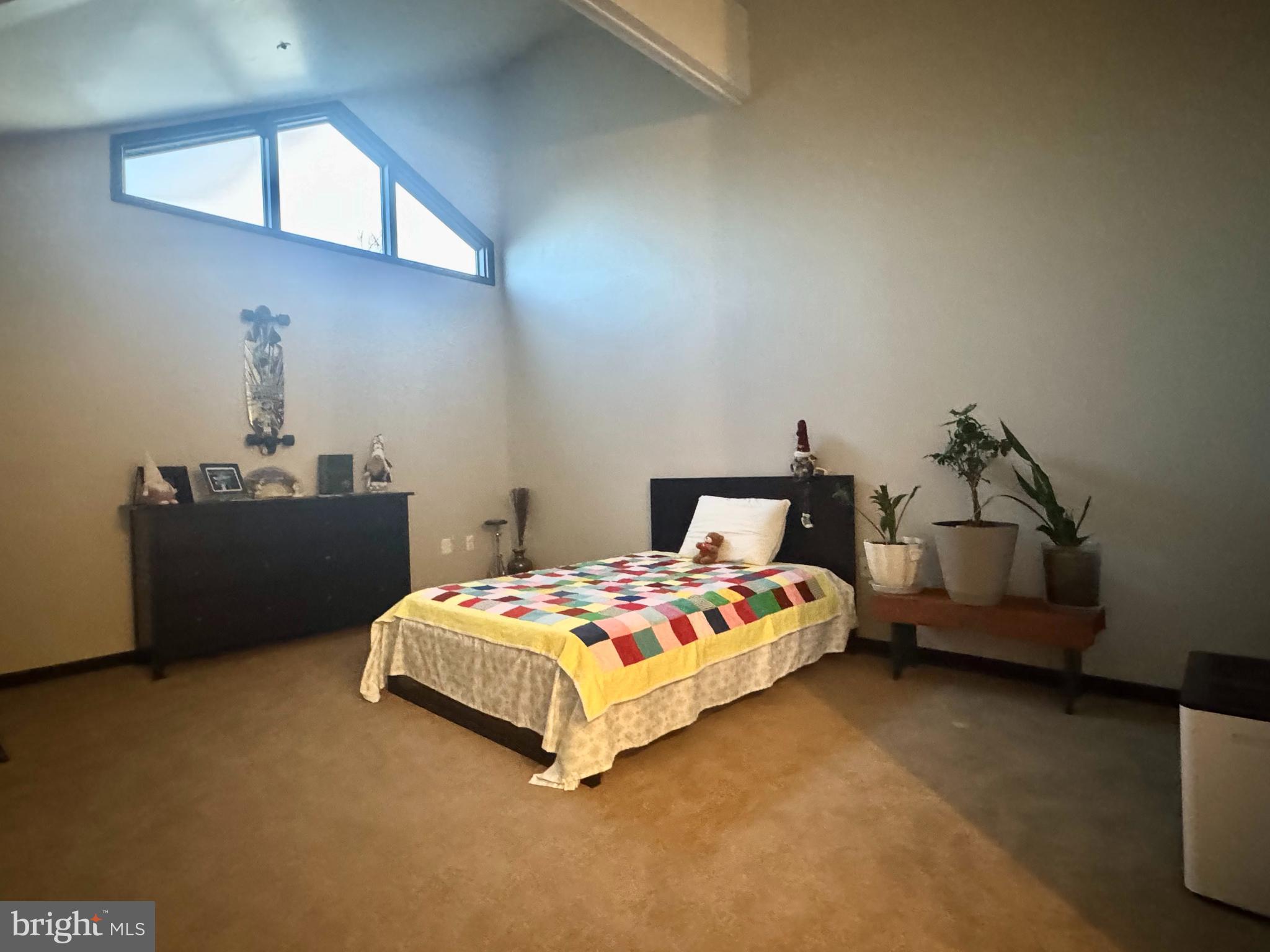 345 Pleasanton Road, Unit A31 Westminster, MD 21157 - Photo 10 of 16 a bedroom with a bed and a window