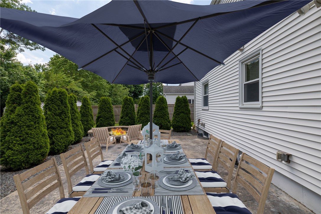 61 Knowles Drive Warwick, RI 02888 - Photo 33 of 43 Virtually staged dinner party on the patio!
