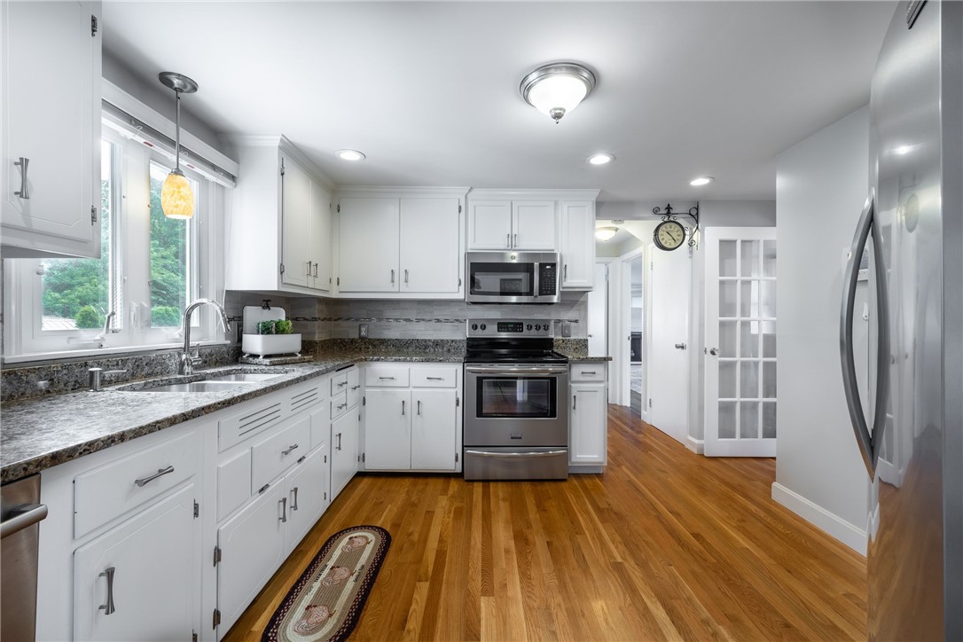 61 Knowles Drive Warwick, RI 02888 - Photo 8 of 43 Newly renovated granite and stainless kitchen