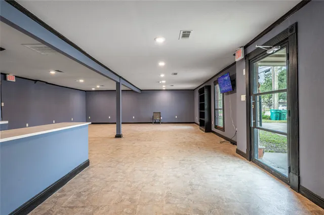 a view of an empty room with a window