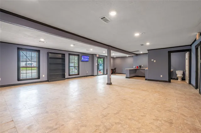 a view of an empty room with closet