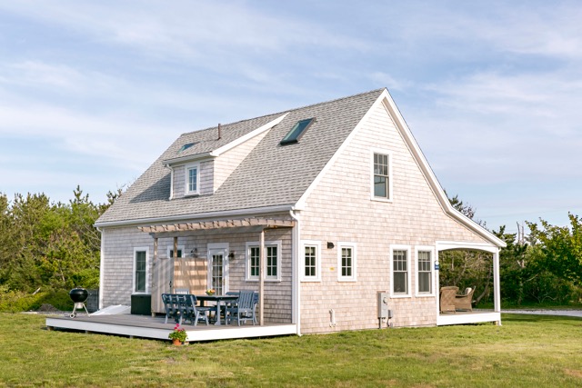 9 Dunes Road Edgartown, MA 02539 - Photo 12 of 12 a view of a house with a lounge chairs in a patio