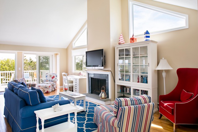 9 Dunes Road Edgartown, MA 02539 - Photo 3 of 12 a living room with furniture a fireplace and a flat screen tv