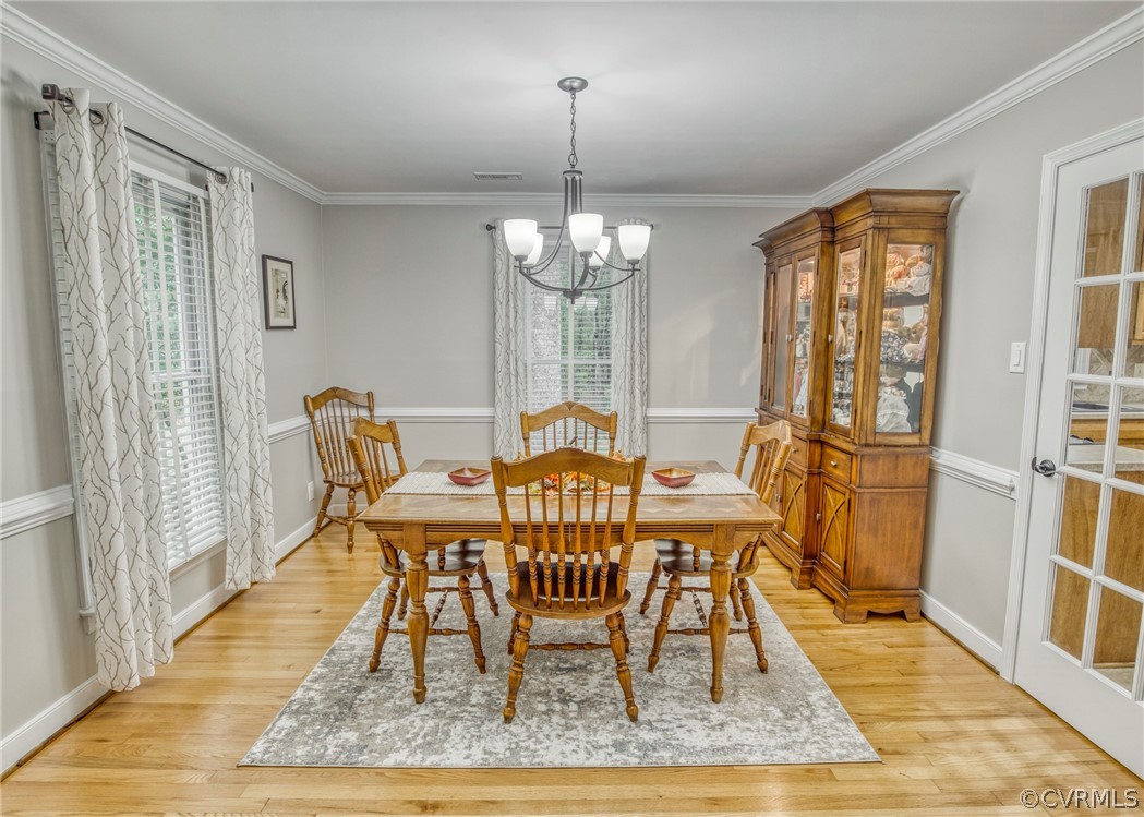 14304 Chimney House Road Midlothian, VA 23112 - Photo 13 of 50 a view of a dining room with furniture window and wooden floor
