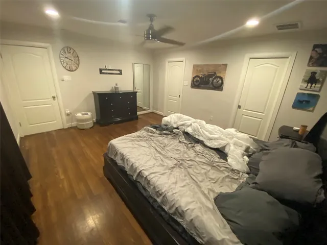 a bedroom with a bed and a couch