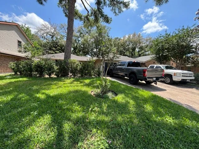 a house view with a garden space