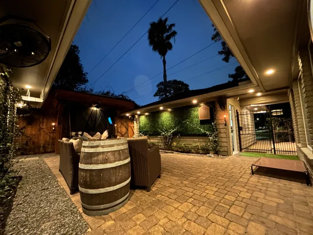 a building outdoor space with patio furniture and potted plants