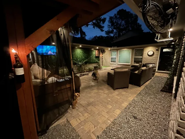 a living room with furniture a projector and a flat screen tv