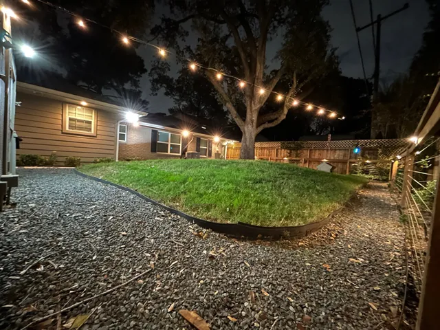 a view of a backyard with pathway