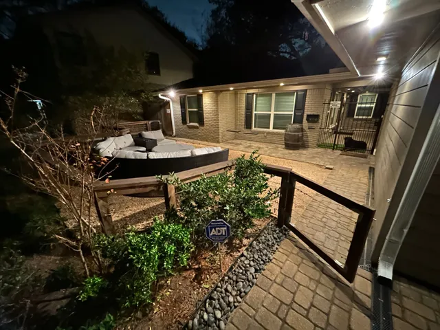 a view of a patio with couches and potted plants