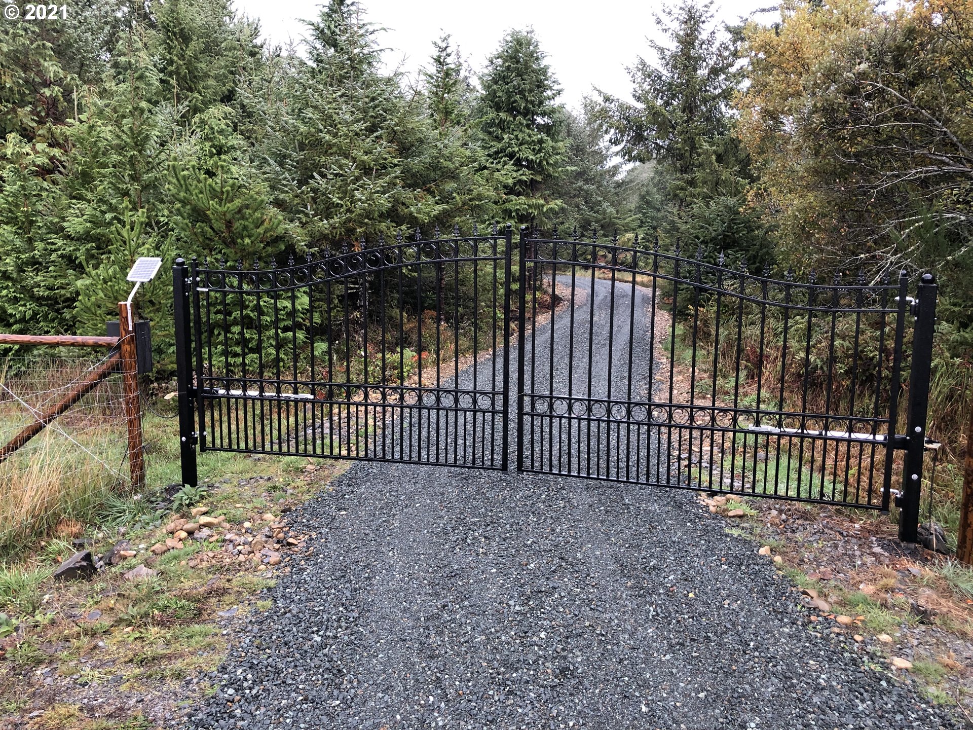 a view of a gate with a fence