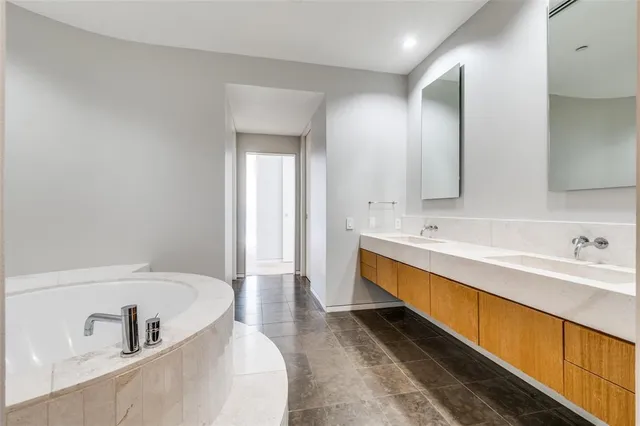 a bathroom with a bathtub and shower