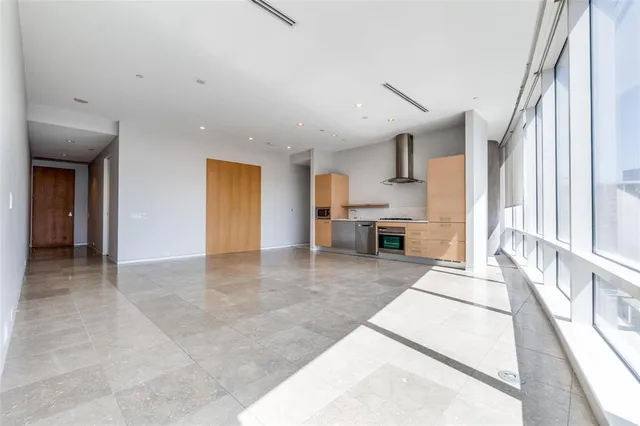 a view of an empty room with a sliding door