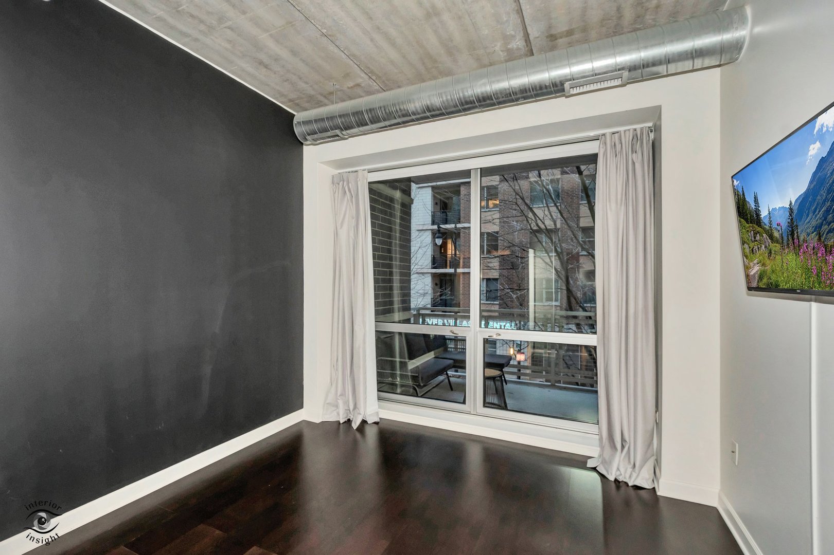 845 North Kingsbury Street, Unit 211 Chicago, IL 60610 - Photo 11 of 26 a view of a hallway with wooden floor and windows