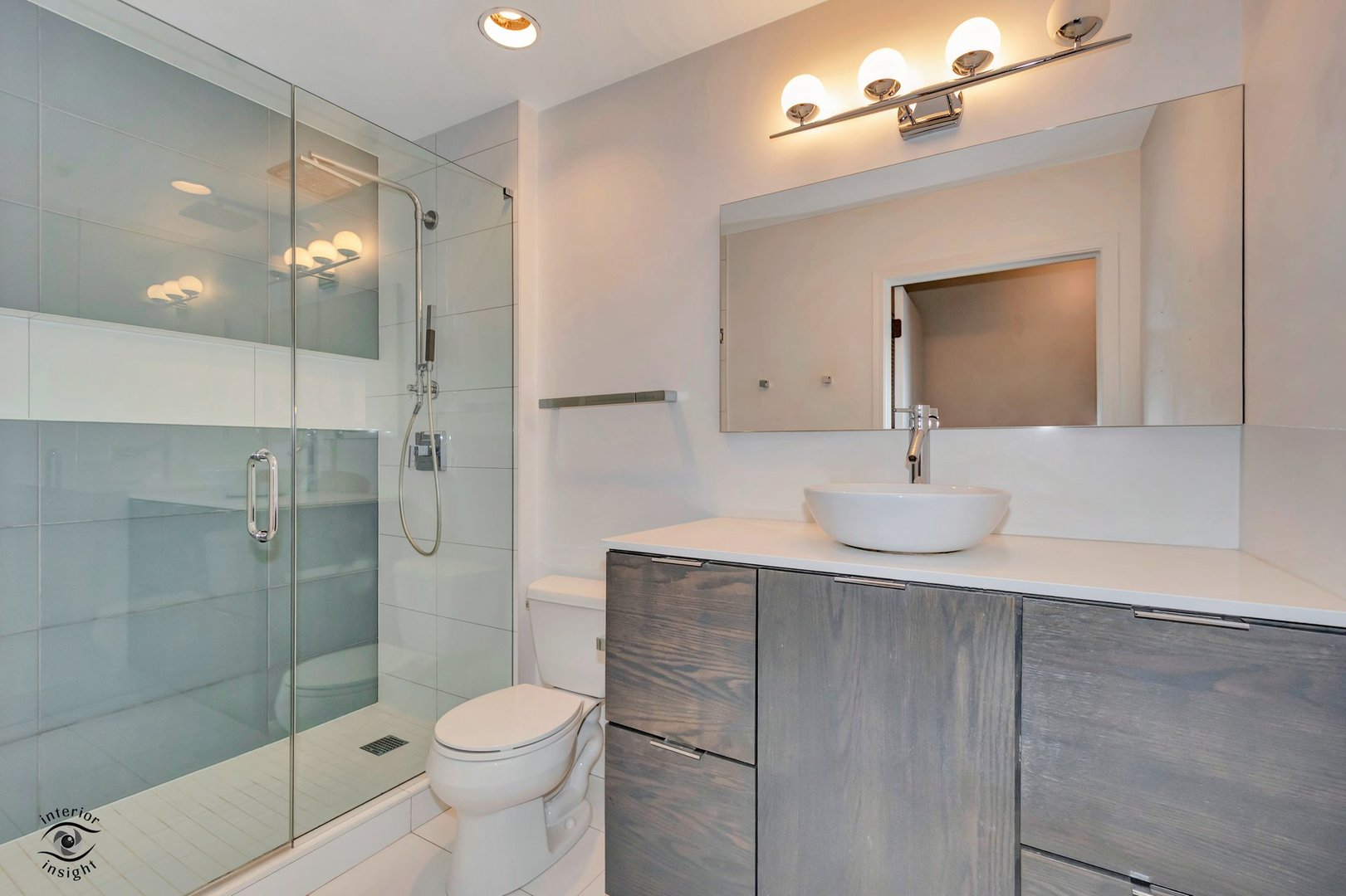 845 North Kingsbury Street, Unit 211 Chicago, IL 60610 - Photo 14 of 26 a bathroom with a sink toilet and shower