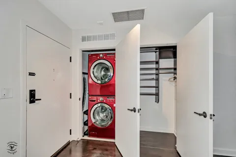 a view of an entryway with wooden floor