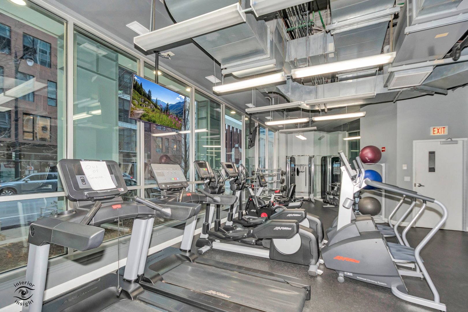 845 North Kingsbury Street, Unit 211 Chicago, IL 60610 - Photo 22 of 26 a view of a room with gym equipment