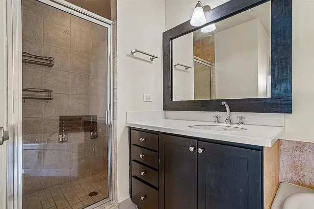 a bathroom with a sink and mirror