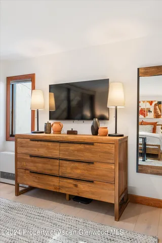 a bedroom with a bed and lamp