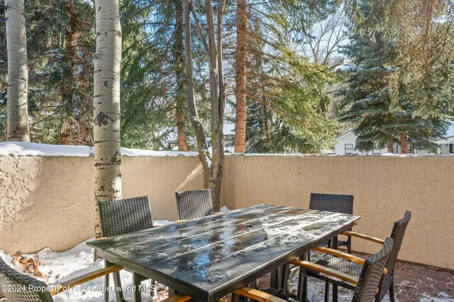 an outdoor space with lounge chair