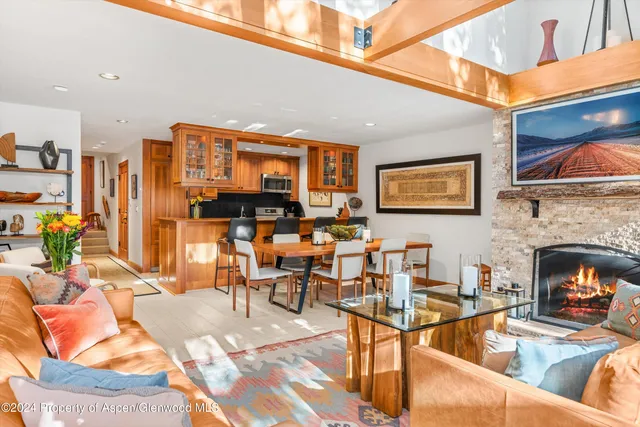 a living room with fireplace furniture and a fireplace