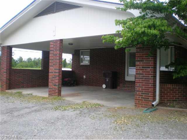 8624 Hudson James Road Summerfield, NC 27358 - Photo 15 of 15 Parking Lot/Garage. Attached, two car carport with side entry leading into the sunroom.