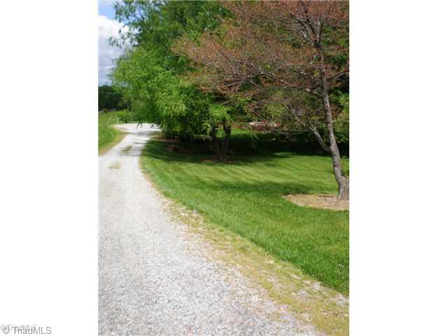 8624 Hudson James Road Summerfield, NC 27358 - Photo 3 of 15 View. Driveway view from street