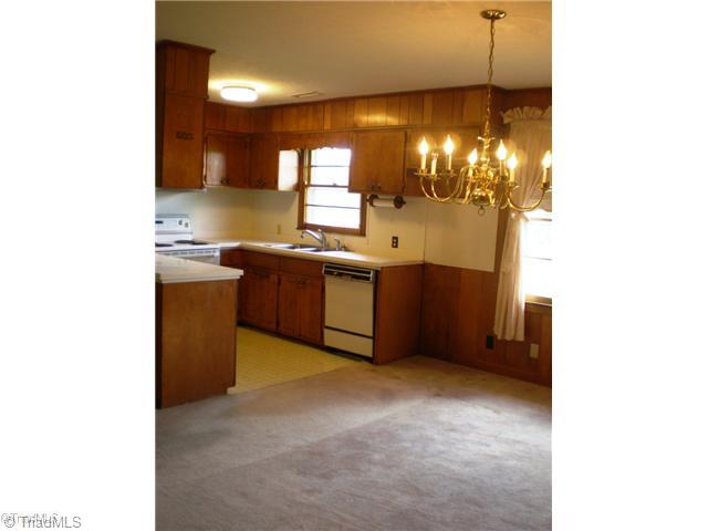 8624 Hudson James Road Summerfield, NC 27358 - Photo 8 of 15 Kitchen. Kitchen opens to dining room and den
