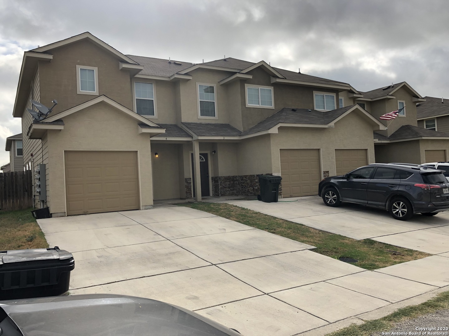 16822 Showdown Path, Unit 2 Selma, TX 78154 - Photo 1 of 1 a car parked in front of white house