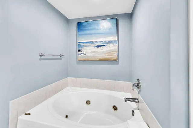 a bathroom with a bathtub and a toilet