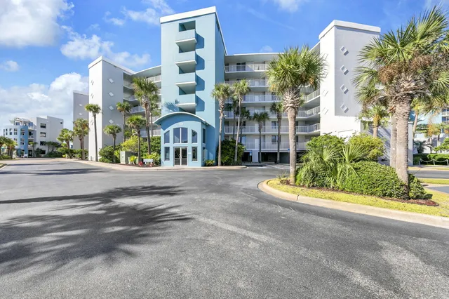 a view of a hallway with closet and a window