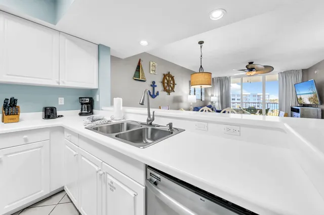 a kitchen with stainless steel appliances a refrigerator stove and microwave